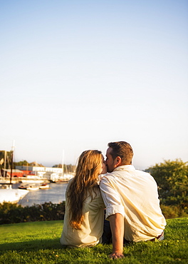 Couple kissing, harbor in background, Camden, Maine