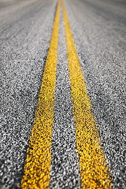 Close-up of double yellow line on road