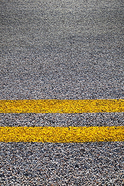 Close-up of double yellow line on road