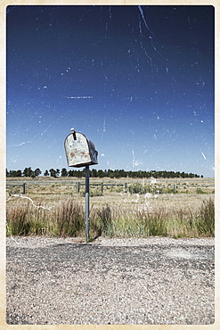 Old mailbox by rural road, Wyoming