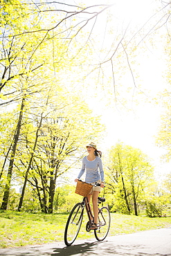 Mid adult woman riding bicycle, Central Park, New York City