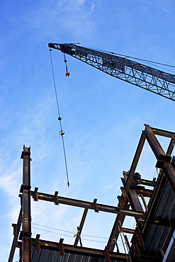 Low angle view of construction site and crane