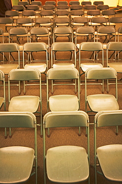 Empty folding chairs in rows