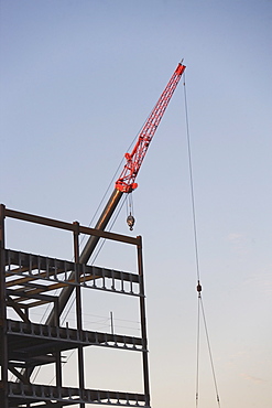 Crane with unfinished built structure