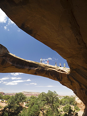 People walking on rock formation