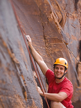 Close up of man rock climbing