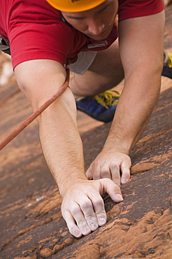 Close up of man rock climbing