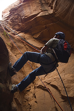 Man canyon rappelling