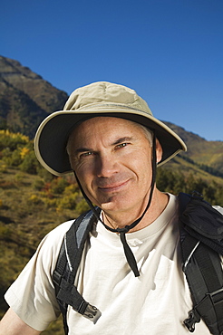 Senior man wearing backpack, Utah, United States