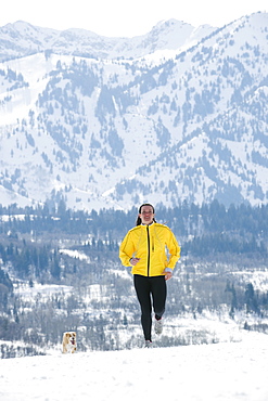 Woman running in snow