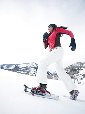 Woman snow shoeing