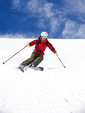 Woman skiing downhill