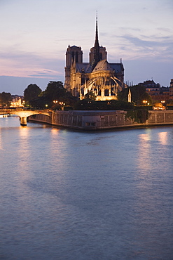 Scenic view of cathedral next to water at night