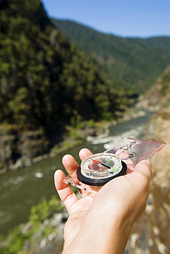 Hiker holding compass