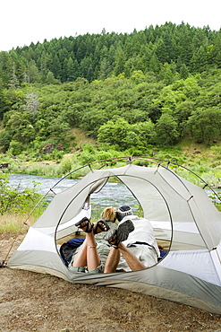 Couple relaxing in tent