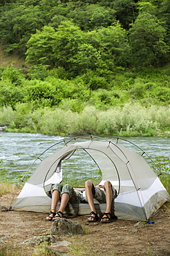 Couple relaxing in tent