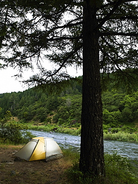 Tent and campsite by river