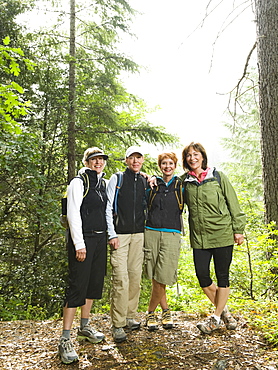 Female hikers posing in forest