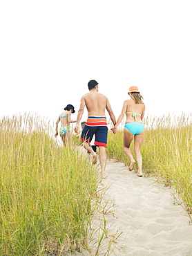 Family walking on beach