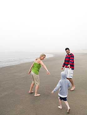 Parents and son on beach