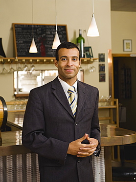 Businessman posing in restaurant