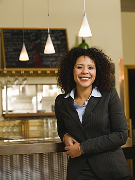 Businesswoman posing in restaurant