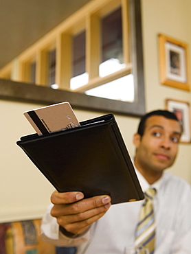 Man paying bill in restaurant