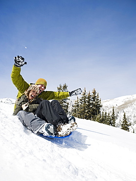 A couple sledding