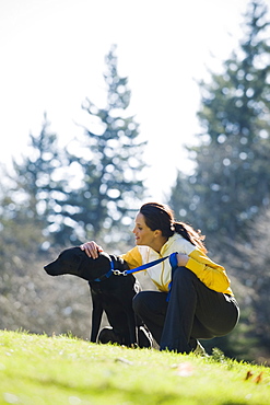 A woman with a dog outdoors