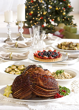 Spiral ham and side dishes on Christmas table