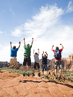 A father with kids at Red Rock jumping