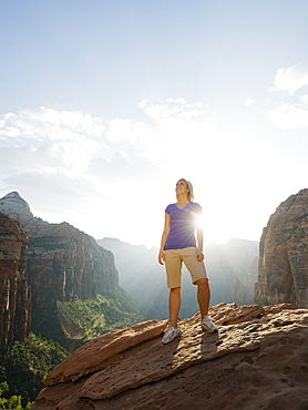 A woman standing at an apex at Red Rock