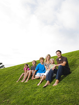 Family sitting on grass