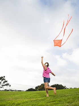 Girl flying a kite