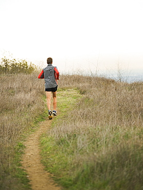 Person running on trail