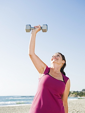 Woman exercising with dumbbell