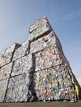 Stacks of crushed aluminum cans