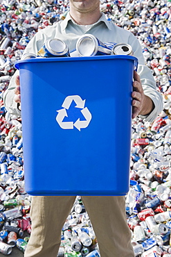 Man holding blue bin