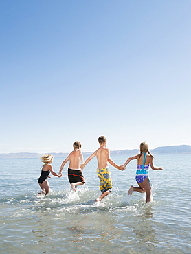 Kids (6-7,8-9,10-11,12-13) playing in lake