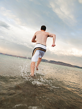 Man running on beach