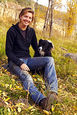 Portrait of woman with her collie outdoors, Colorado, USA