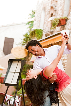 France, Cassis, Couple dancing on street, France, Cassis