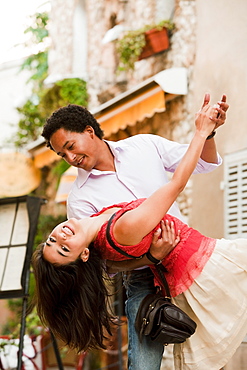 France, Cassis, Couple dancing on street, France, Cassis