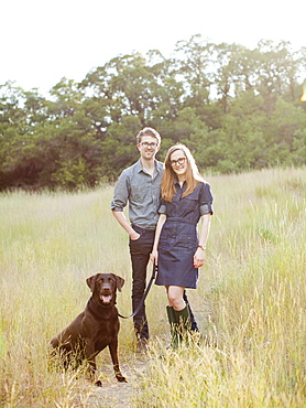 Portrait of young couple with dog, USA, Utah, Salt Lake City