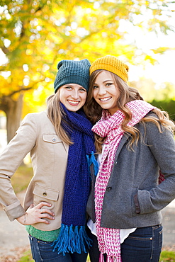 Portrait of two young women wearing hats and scarves