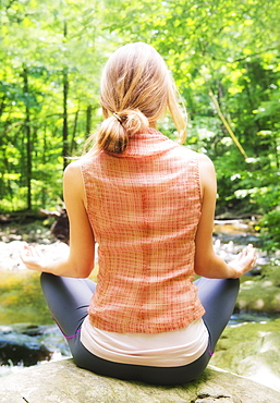 Woman practicing joga in forest, USA, New Jersey, Mendham