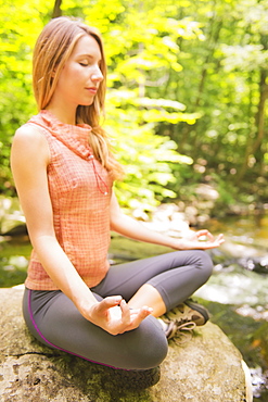 Woman practicing joga in forest, USA, New Jersey, Mendham