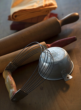 Old fashioned kitchen utensils on wood