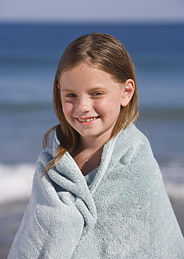 Girl wrapped in beach towel