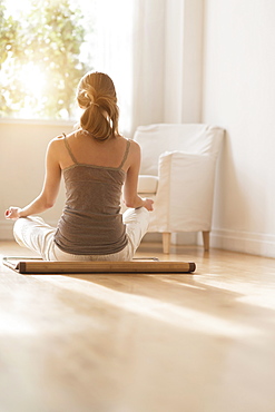 Young woman practicing yoga 